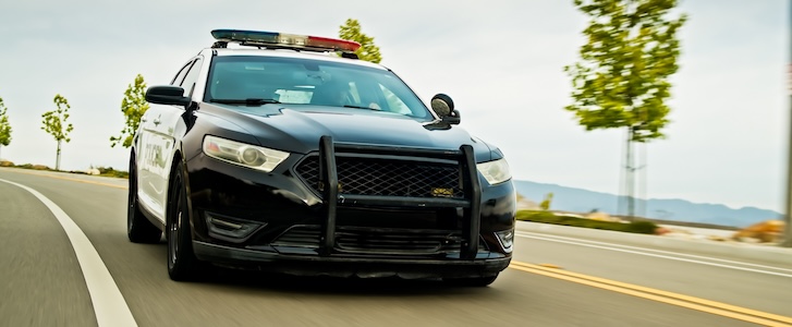 Police car driving on road Police car driving on road